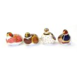 Four Royal Crown Derby paperweights including: Pheasant (silver stopper), Woodland Pheasant (gold