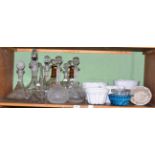Seven ceramic and glass jelly moulds and nine various cut glass and other decanters with stoppers