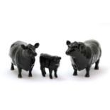 Beswick Cattle comprising: Aberdeen Angus Bull, model No. 1562, Aberdeen Angus Cow, model No. 1563