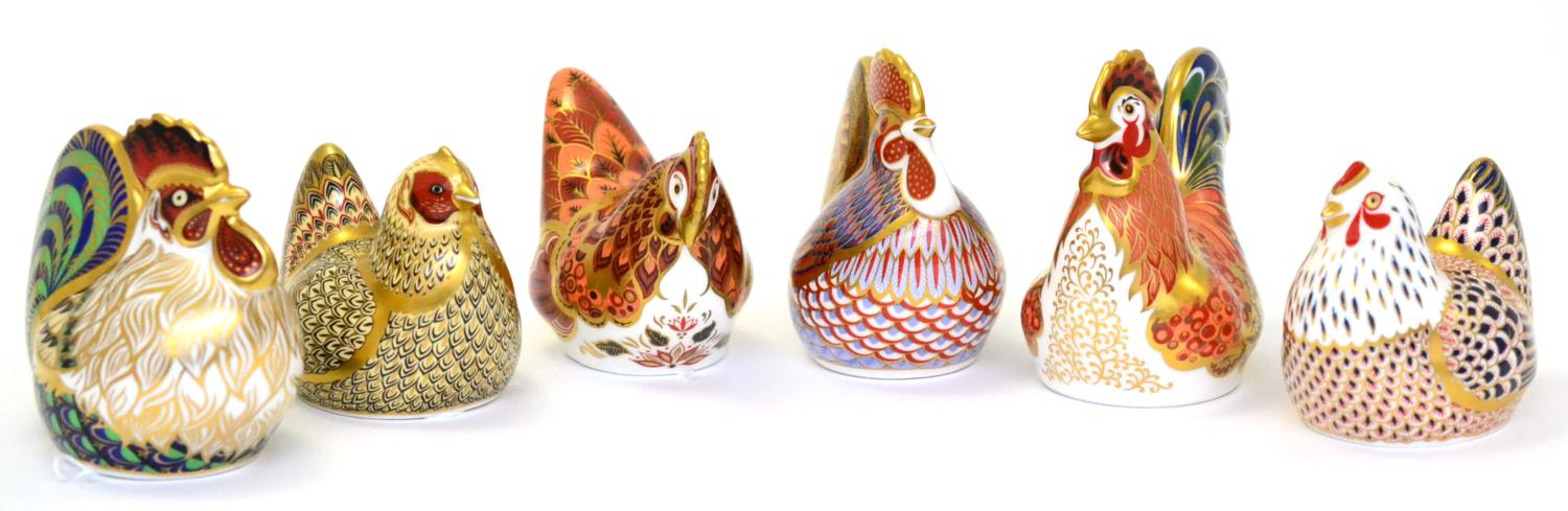 Six Royal Crown Derby paperweights including: Cockerel (gold stopper), Chicken (silver stopper),