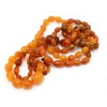 A group of amber coloured bead necklaces (3)