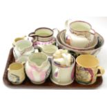 A collection of mainly 19th century Sunderland pink lustre jugs, two mugs and two bowls Large bowl -