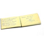 A leather bound autograph album containing signatures of Jack Dempsey, Fred Astaire, Ginger