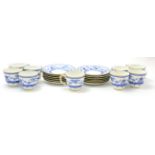 A set of Royal Crown Derby coffee cups and saucers with blue and white decoration