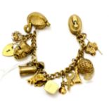 A 9ct gold charm bracelet, 82.7g