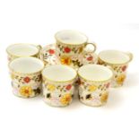 A set of six Royal Crown Derby coffee cans and saucers