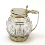 A George III silver mounted cut glass mustard, WE London 1780 or 1820, engraved with two crests
