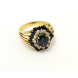 A sapphire and diamond hexagonal cluster ring, stamped '14K'