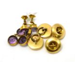 A pair of amethyst trio drop earrings and a pair of button motif cufflinks