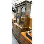 Late Victorian bookcase on four height chest of drawers