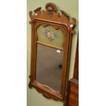 A fret carved gilt wall mirror with painted decoration