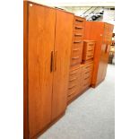 Five piece teak G-plan bedroom suite comprising of two wardrobes, bedside chest, tall boy and four