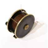 A 4inch Brass Faced Ebonite Salmon Reel, with fat horn handle, nickel rims, brass foot, with line