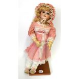 A French Jumeau Bisque Socket Head Child Doll, impressed '7' 'DEP', with blond wig, pierced ears,