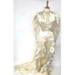 1939 Cream Silk Wedding Dress, with long sleeves, scoop neck, multi buttons to the back and cuffs,