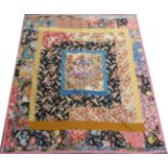 Circa 1930s Patchwork Quilt, with coloured floral patches, pink paisley to reverse and pink trims,