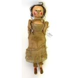 Early 19th Century Carved Wood Doll, with brown eyes, painted face on a wooden body, red painted