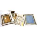 Three silver picture frames, a purse/sovereign case stamped ''Sterling'', silver propelling