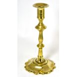 An 18th century brass candlestick