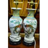 A pair of modern Chinese famille rose enamel vases mounted as lamps