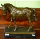 A bronze model of a horse on marble plinth base