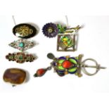 An enamelled brooch by Ivar Holt, two enamelled brooches, a pin and three stone set brooches