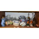 A collection of cut glass, decorative ceramics and ornamental items including decanters, sundae