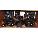 Three ebony tribal figures and eight masks