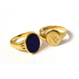 A lapis lazuli set intaglio signet ring and a gold ring