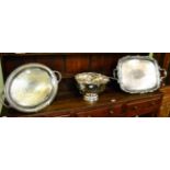 Two large silver plated twin handled trays together with a silver plated punch bowl, cups and ladle