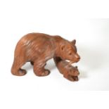 A carved wooden sculpture of a bear and cub 31.5cm long, 19cm high. 20th century. Estimate £50-70.