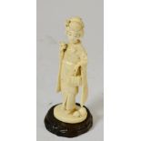 A late 19th century Japanese carved ivory figure 15.5cm high, slight discolouration consistent