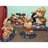 Four Victorian painted cast iron door stops including a Lion Passant, Punch & Judy, etc
