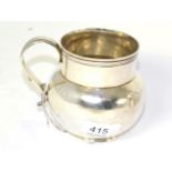 A cast fake copy of a Queen Anne silver mug, marks cancelled, LAO case number to base