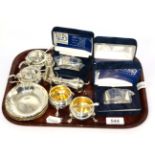 Small group of silver including a six piece condiment set, three cased napkin rings and a set of