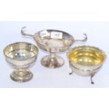A silver Art Nouveau twin handled dish, a silver sugar bowl and a silver footed dish 12.9 ozt