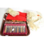 A collection of modern lace bobbins and lace