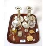 Silverware including a pair of candlesticks, inkwell (liner a.f.), beaker, vesta case, pocket watch,