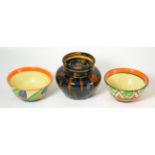 A Clarice Cliff Bizzare pattern bowl together with another (a.f.) and a studio pottery jar and cover