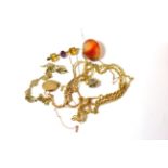 A group of gold jewellery including a 9ct gold locket, 9ct gold chain with hardstone pendant, 9ct