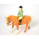 Beswick Boy on Pony, model No. 1500, palomino gloss Pony has a chip to the tip of left ear -