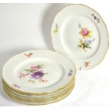 A set of seven 20th century Meissen dessert plates, decorated with floral sprays Slight wear to