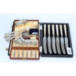 A cased set of six silver handled tea knives, cased set of six silver coffee spoons, three silver