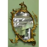 A Rococo style gilt framed mirror