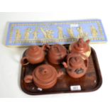 A reproduction jasperware plaque, together with five Yi Xing teapots