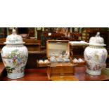 A pair of Chinese porcelain jars and covers decorated with figures and each with fo dog knop 62cm