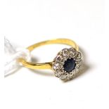 A sapphire and diamond flower head cluster ring