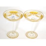 A pair of Edwardian engraved and gilt glass stem dishes Gilding in good condition, slight marks to