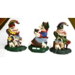 Three cast iron doorstops in the form of Mr Punch