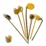 Assorted stick pins, one with a gold dollar